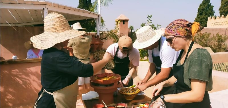 chef Naima showing spices during a cooking class, riad in Marrakech with airport transfer arranged on request